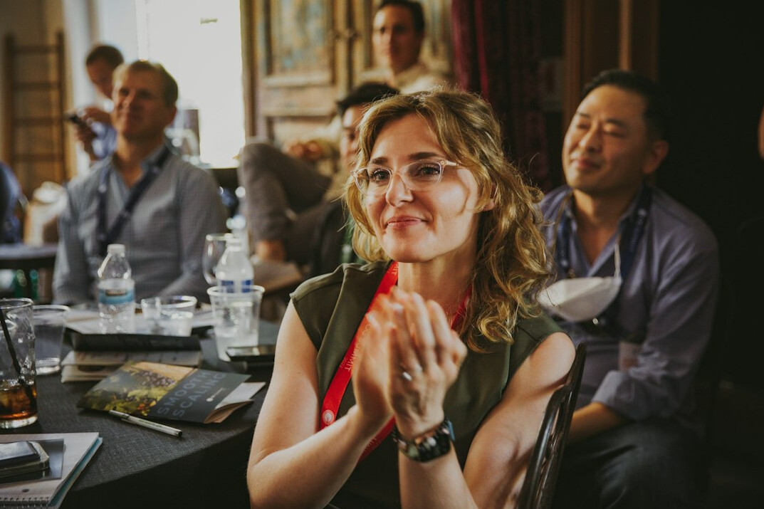 woman presenting at conference